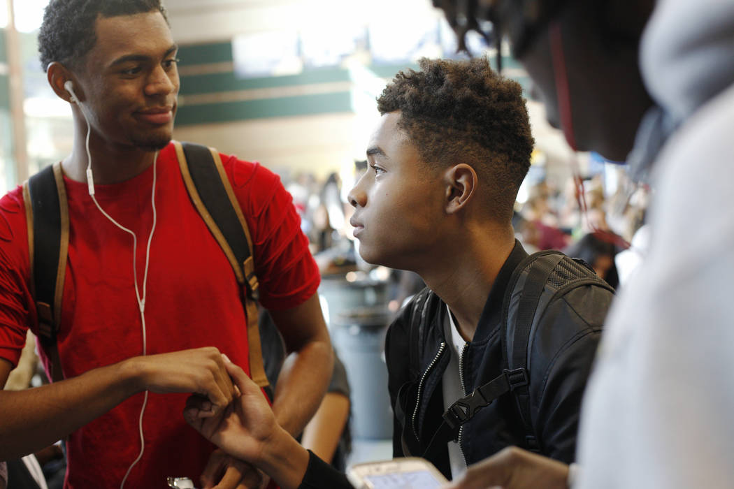 D'Andre Burnett, 17, talks to friends during lunch at Shadow Ridge High School in Las Vegas, Thursday, Oct. 19, 2017. Burnett has a 50-50 chance of graduating, and faces the same obstacles thousan ...