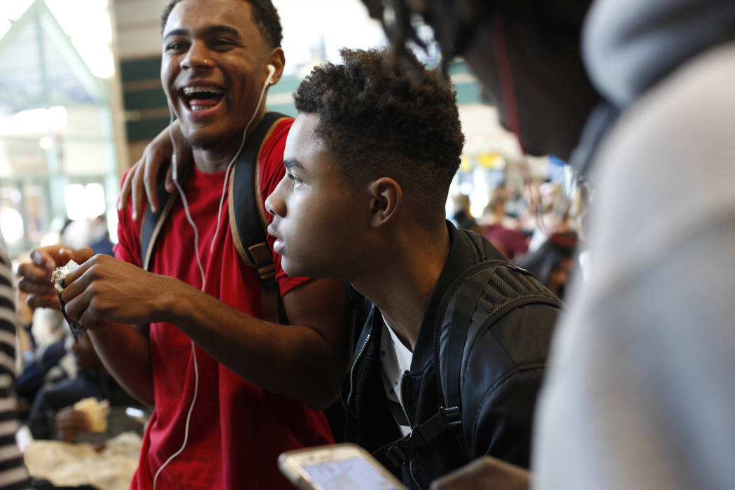 D'Andre Burnett, 17, talks to friends during lunch at Shadow Ridge High School in Las Vegas, Thursday, Oct. 19, 2017. Burnett has a 50-50 chance of graduating, and faces the same obstacles thousan ...