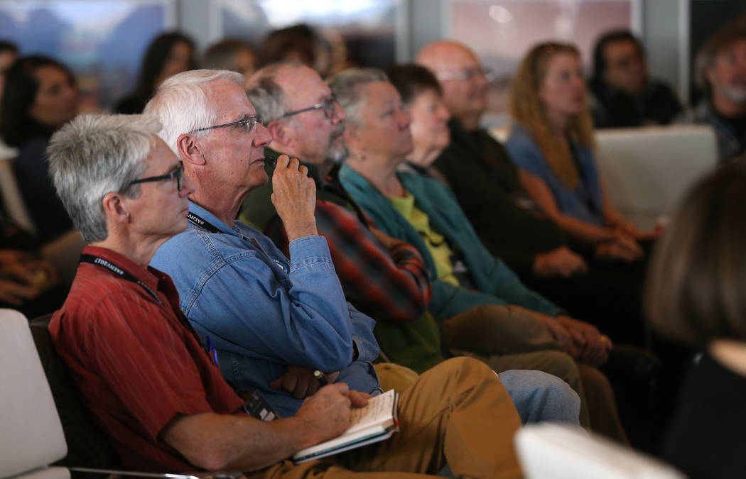 Visitors listen as artist Trevor Paglen gives a presentation about his Orbital Reflector art piece at the Nevada Museum of Art in Reno on Friday, Oct. 20, 2017. The 14-foot model at the museum is  ...
