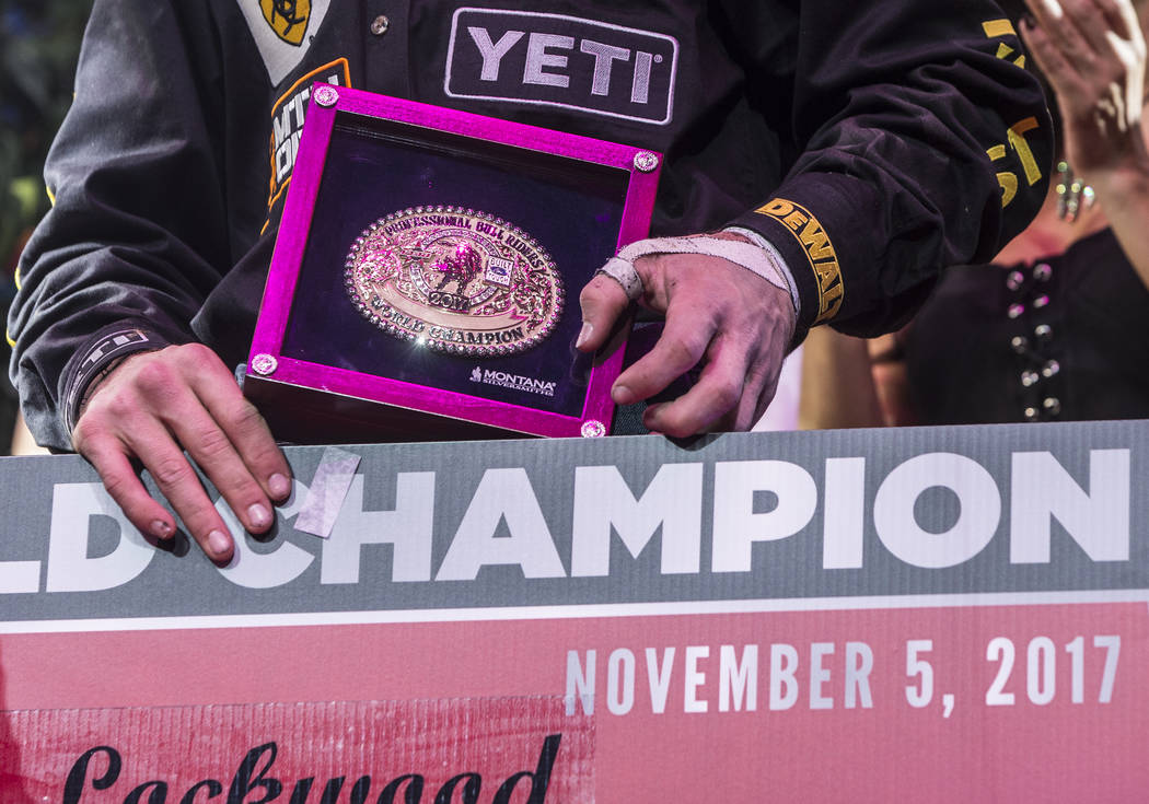 Jess Lockwood holds the 2017 Professional Bull Riders World Champion gold belt buckle on Sunday, Nov. 5, 2017, at T-Mobile Arena, in Las Vegas. Benjamin Hager Las Vegas Review-Journal @benjaminhphoto