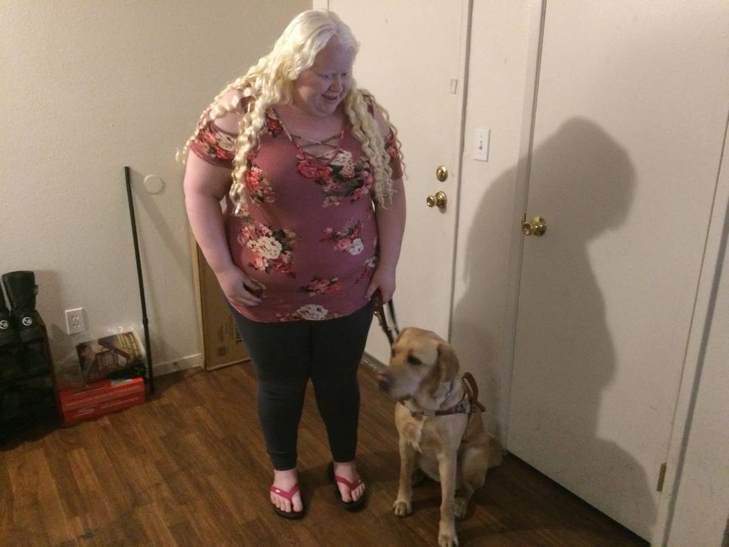 Vanessa Rosado asked Riley, her new Guiding Eyes dog, to sit before they step outside their apartment Oct. 20, 2017. Rosado flew to New York where Guiding Eyes for the Blind is headquartered and w ...