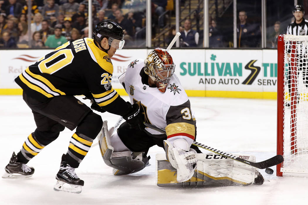 Boston Bruins' Riley Nash, left, cannot get the puck past Vegas Golden Knights goalie Maxime Lagace during the second period of an NHL hockey game in Boston, Thursday, Nov. 2, 2017. (AP Photo/Wins ...
