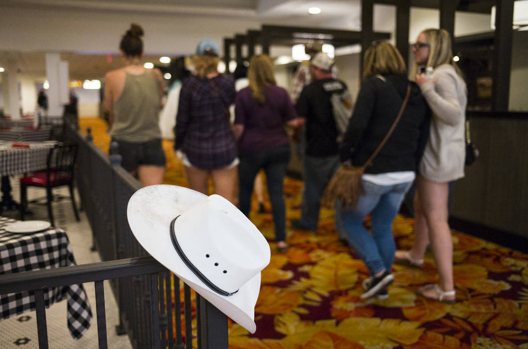 A cowboy hat is left behind as people make their way out of Tropicana Las Vegas following an active shooter situation on the Las Vegas Strip during the early hours of Monday, Oct. 2, 2017. Chase S ...
