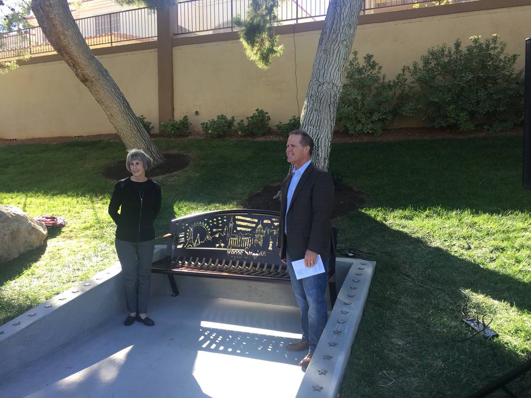 Clark County Commissioner Susan Brager and Nevada Lt. Gov. Mark Hutchison flank a commemorative bench dedicated Saturday afternoon at the Peccole Ranch community in western Las Vegas.
