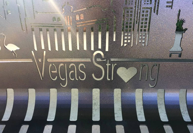 Sunlight streams through a portion of the newly dedicated bench along a walking trail at the Peccole Ranch community in western Las Vegas. The bench, commemorating the victims of the Las Vegas sho ...
