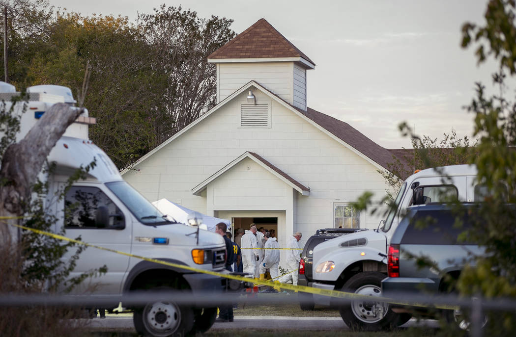 Investigators work at the scene of a mass shooting at the First Baptist Church in Sutherland Springs, Texas, on Sunday Nov. 5, 2017. A man opened fire inside of the church in the small South Texas ...