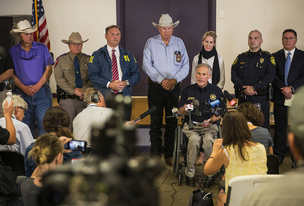 Texas Gov. Greg Abbott addresses members of the media about a deadly shooting at the First Baptist Church in Sutherland Springs, during a press conference in Stockdale, Texas, Sunday, Nov. 5, 2017 ...