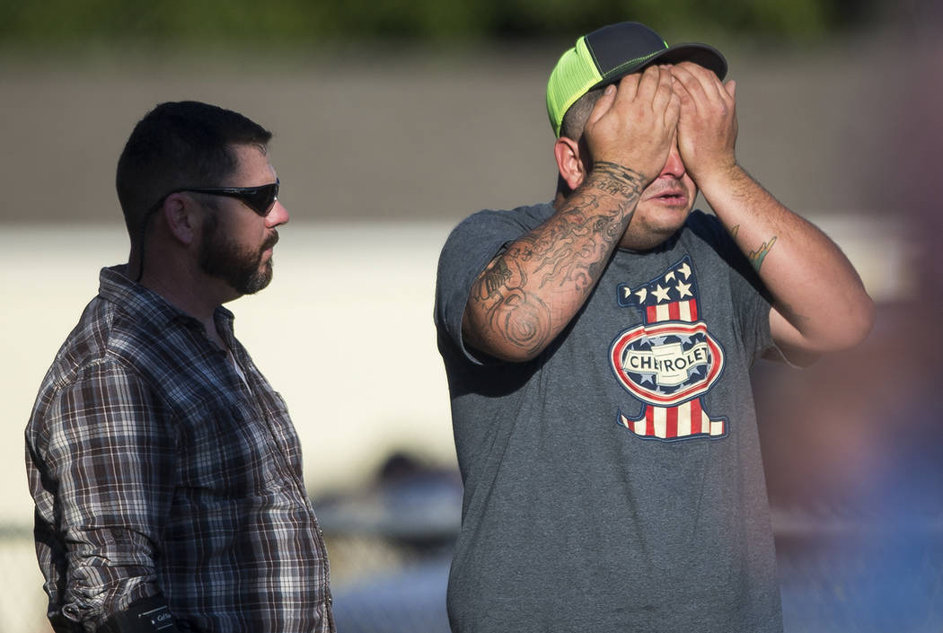 A man wipes his eyes after a deadly shooting at the First Baptist Church in Sutherland Springs, Texas, Sunday, Nov. 5, 2017. A man opened fire inside of the church in the small South Texas communi ...
