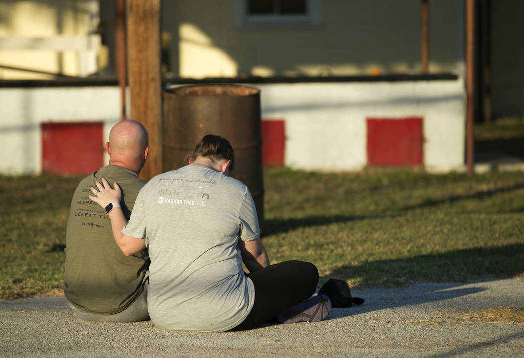 A couple comfort each other at a community center in Sutherland Springs, Texas, near the scene of a mass shooting at the First Baptist Church on Sunday, Nov. 5, 2017. A man opened fire inside of t ...