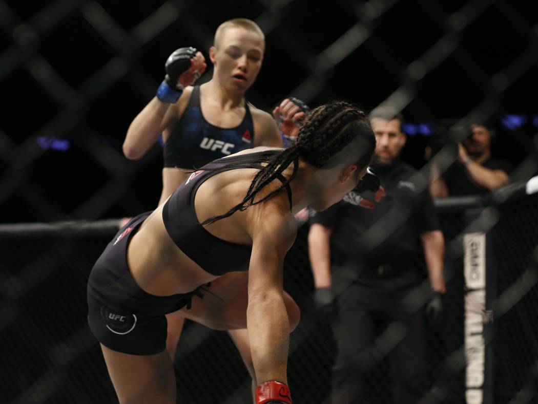 Nov 4, 2017; New York, NY, USA;  Rose Namajunas (blue gloves) fights Joanna Jedrzejczyk (red gloves) during UFC 217 at Madison Square Garden. (Noah K. Murray-USA TODAY Sports)