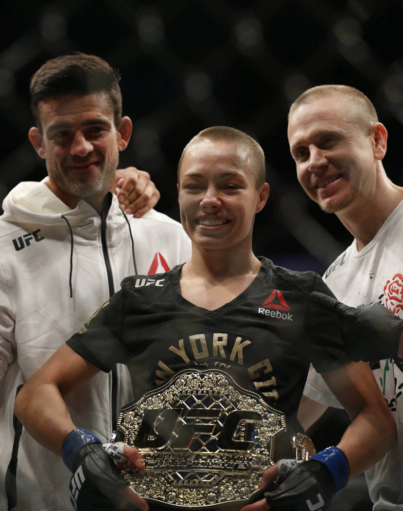 Nov 4, 2017; New York, NY, USA;  Rose Namajunas (blue gloves) celebrates with the belt after defeating Joanna Jedrzejczyk (red gloves) during UFC 217 at Madison Square Garden. (Noah K. Murray-USA  ...