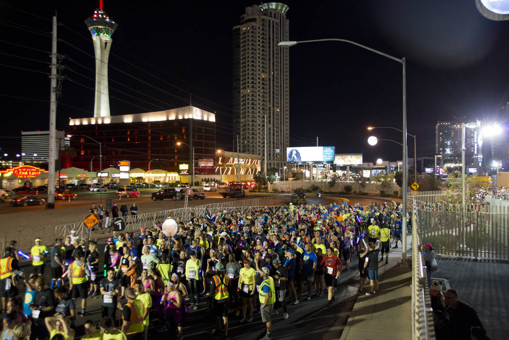 Runners wait for their corral number to be called during the 5K portion of the Rock ԮՠRoll Las Vegas Marathon at the Las Vegas Festival Grounds on The Strip on Saturday, Nov. 11, 2017. ...