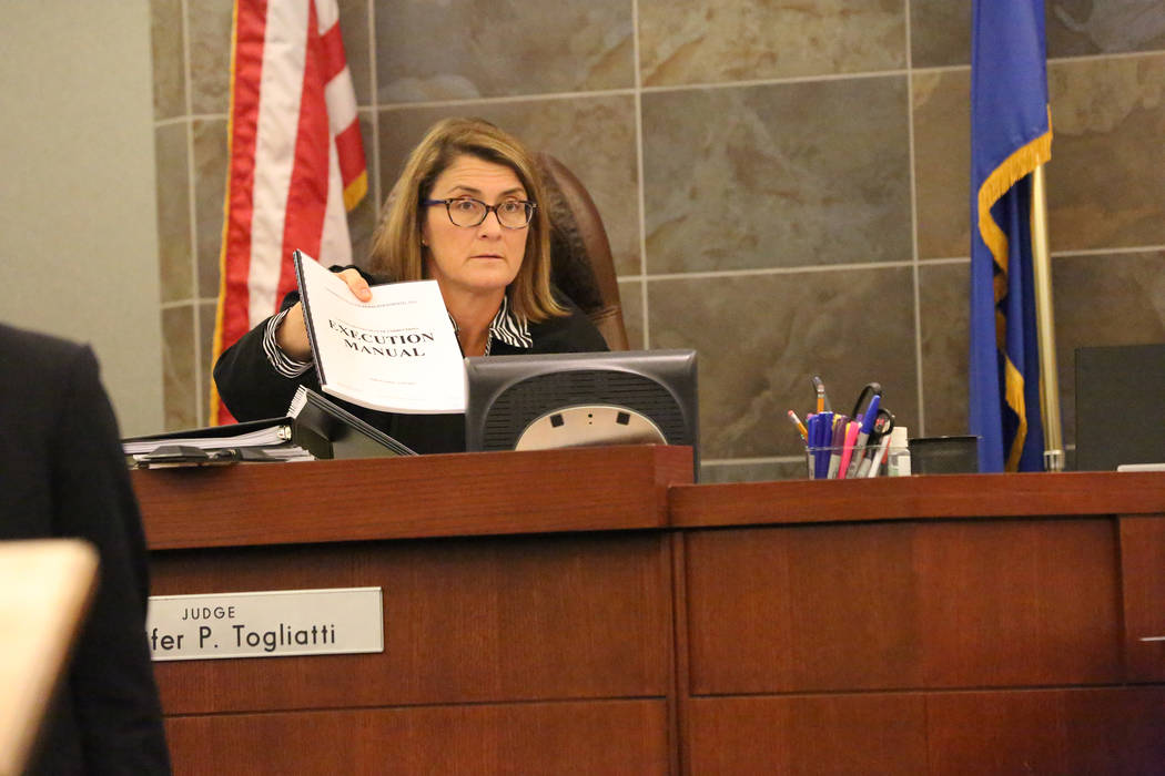 District Judge Jennifer Togliatti holds the execution manual during a hearing for Scott Dozier on Wednesday, Nov. 8, 2017, at the Regional Justice Center in Las Vegas. Michael Quine/Las Vegas Revi ...
