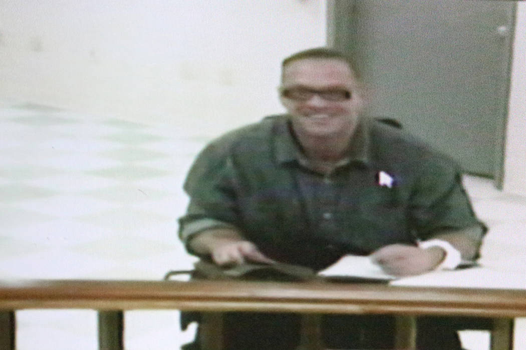 Scott Dozier, a convicted murderer who wants to be executed, appears in court via video conference on Wednesday, Nov. 8, 2017, four business days before his scheduled execution. Michael Quine/Las  ...