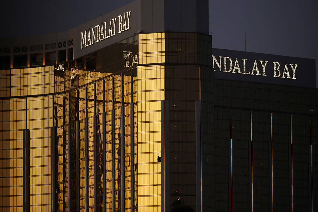 Windows are broken at the Mandalay Bay resort and casino, Tuesday, Oct. 3, 2017, in Las Vegas. Authorities said Stephen Paddock broke the windows and began firing with a cache of weapons, killing  ...