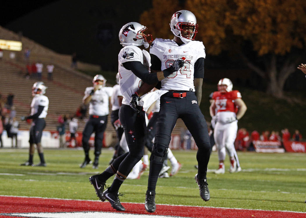 UNLV wide receiver Kendal Keys, right, celebrates with a teammate after scoring the go-ahead touchdown against New Mexico during the final minute of an NCAA college football game in Albuquerque, N ...