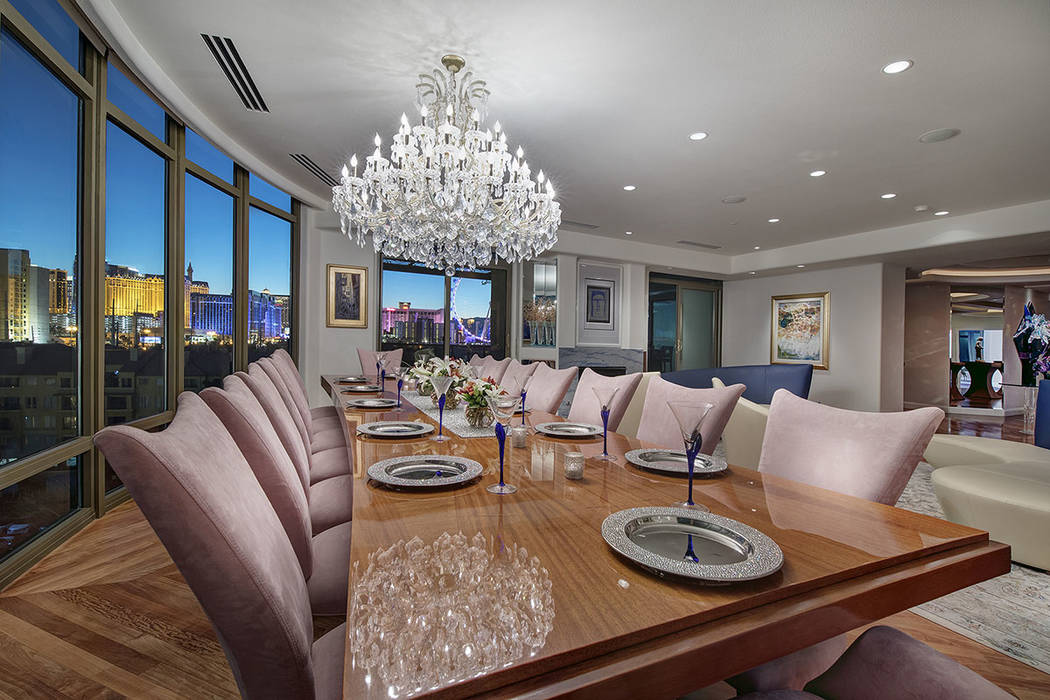 A formal dining room is in one of the Park Towers units that were combined to create a large living space on the second floor of one of the high-rise buildings. (Synergy|Sotheby’s International  ...