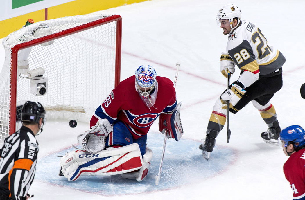 Montreal Canadiens goalie Charlie Lindgren stops Vegas Golden Knights' William Carrier during the second period of an NHL hockey game, Tuesday, Nov. 7, 2017, in Montreal. (Paul Chiasson/The Canadi ...
