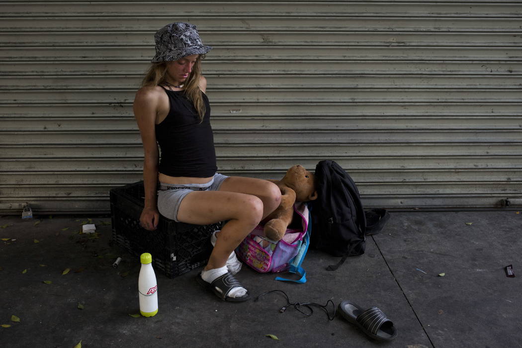 A young homeless woman, in a drug-induced state