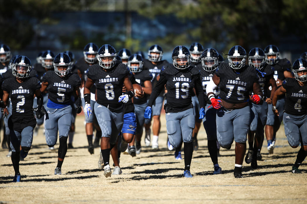 Desert Pines runs onto the field before the start of the Class 3A State football game against Spring Creek at Desert Pines High School in Las Vegas, Saturday, Nov. 18, 2017. Joel Angel Juarez Las ...