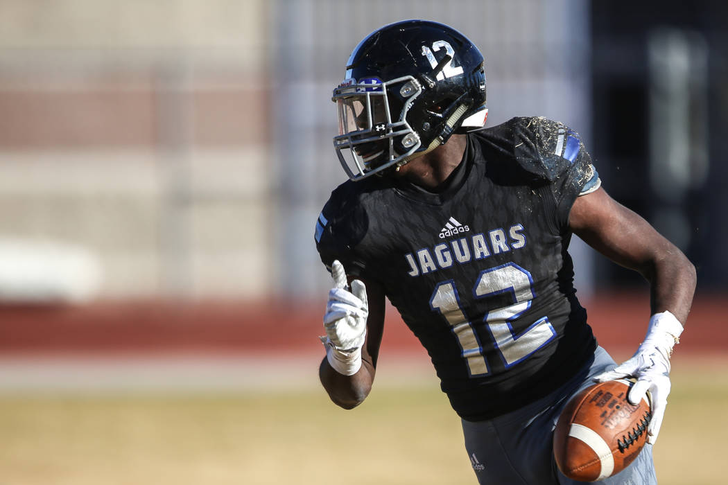 Desert Pines' Jyden King (12) scores a touchdown against Spring Creek during the second quarter of the Class 3A State football game at Desert Pines High School in Las Vegas, Saturday, Nov. 18, 201 ...