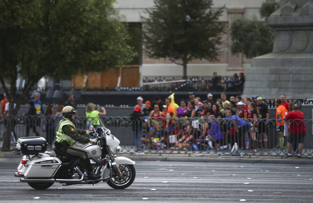 Las Vegas police officers help shut down the Las Vegas Strip to traffic before the start of the Rock 'n' Roll Marathon in Las Vegas on Sunday, Nov. 12, 2017. Chase Stevens Las Vegas Review-Journal ...