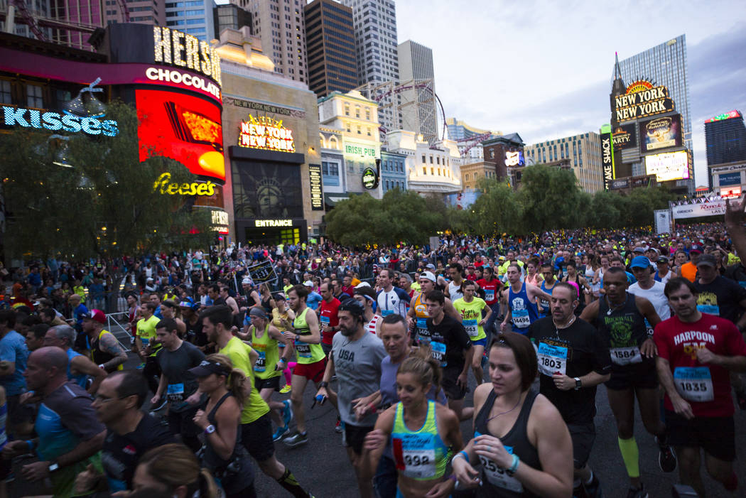 Participants head out from the start line outside of the New York-New York at the beginning of the Rock 'n' Roll Marathon in Las Vegas on Sunday, Nov. 12, 2017. Chase Stevens Las Vegas Review-Jour ...