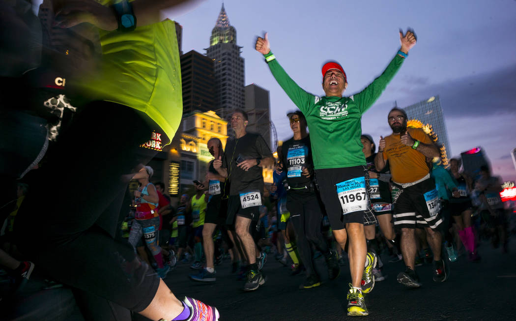 Half marathon participant Benjamin Hernando, center right,  heads out from the start of the Rock 'n' Roll Marathon in Las Vegas on Sunday, Nov. 12, 2017. Chase Stevens Las Vegas Review-Journal @cs ...