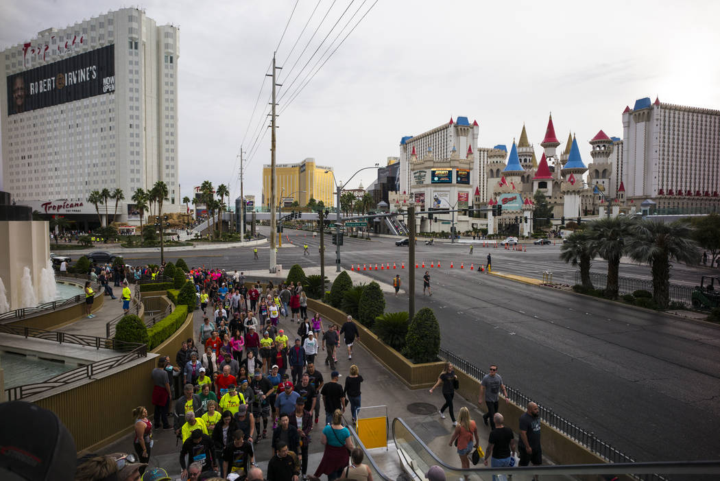 People crowd the intersection of Las Vegas Boulevard and Tropicana Avenue as race participants prepare for the start of the Rock 'n' Roll Marathon in Las Vegas on Sunday, Nov. 12, 2017. Chase Stev ...