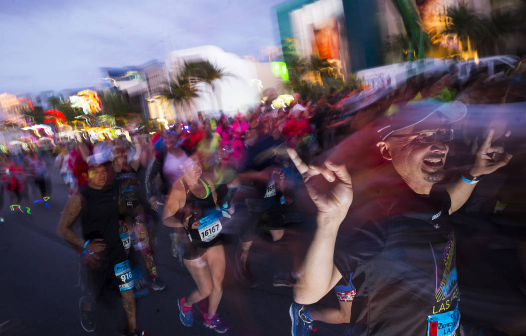 Half marathon participants head out from the start of the Rock 'n' Roll Marathon in Las Vegas on Sunday, Nov. 12, 2017. Chase Stevens Las Vegas Review-Journal @csstevensphoto