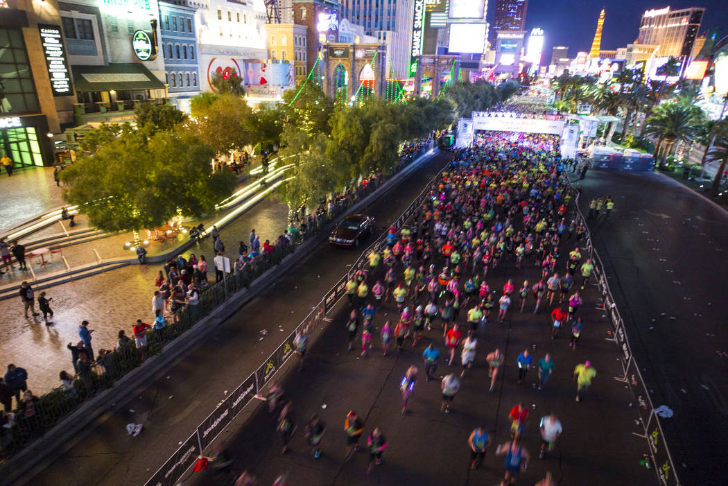Half marathon participants head out from the start of the Rock 'n' Roll Marathon in Las Vegas on Sunday, Nov. 12, 2017. Chase Stevens Las Vegas Review-Journal @csstevensphoto