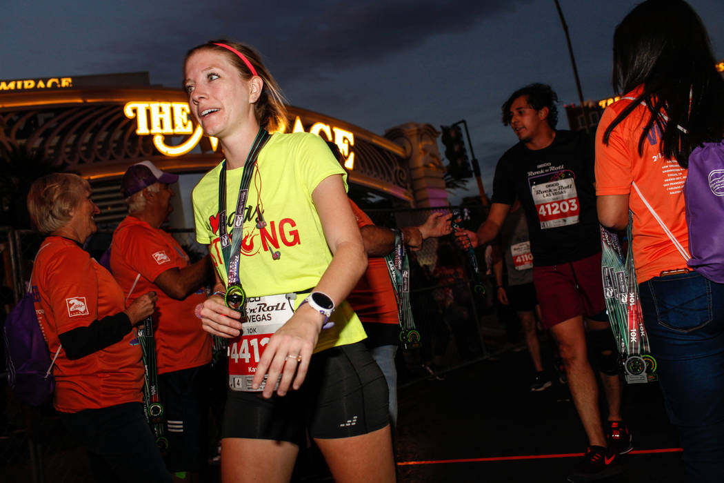 Kayla Hohlt of Austin crosses the finish line at the 10K run of the Rock 'n' Roll Las Vegas Marathon along the Strip near The Mirage in Las Vegas, Sunday, Nov. 12, 2017. Joel Angel Juarez Las Vega ...
