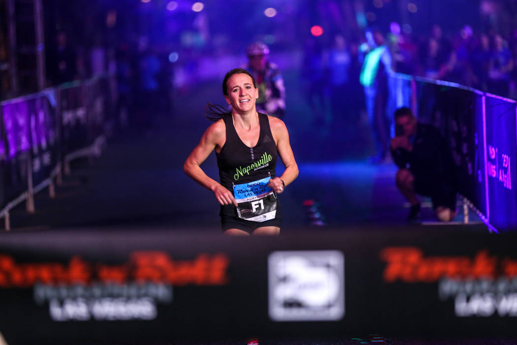 Marisa Hird of Naperville, Illinois runs toward the finish line before winning first place at the women's marathon run of the Rock 'n' Roll Las Vegas Marathon along the Strip near The Mirage in La ...