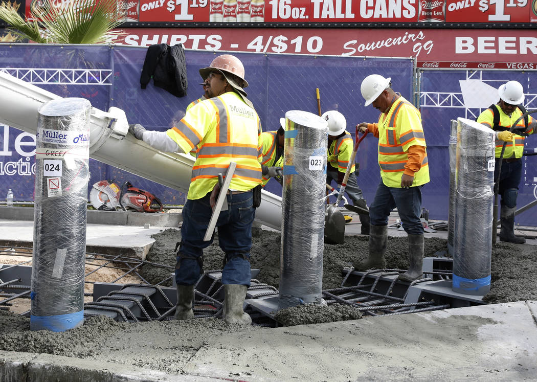 Construction crews pour cement where they began installing steel posts on the Strip near Aria Monday, Nov. 13, 2017, to protect pedestrians along Las Vegas Boulevard. (Bizuayehu Tesfaye/Las Vegas  ...