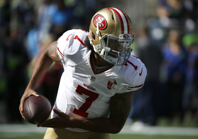San Francisco 49ers quarterback Colin Kaepernick (7) looks to hand off during warmups before an NFL football game against the Seattle Seahawks, Sunday, Sept. 25, 2016, in Seattle. (AP Photo/Ted S. ...