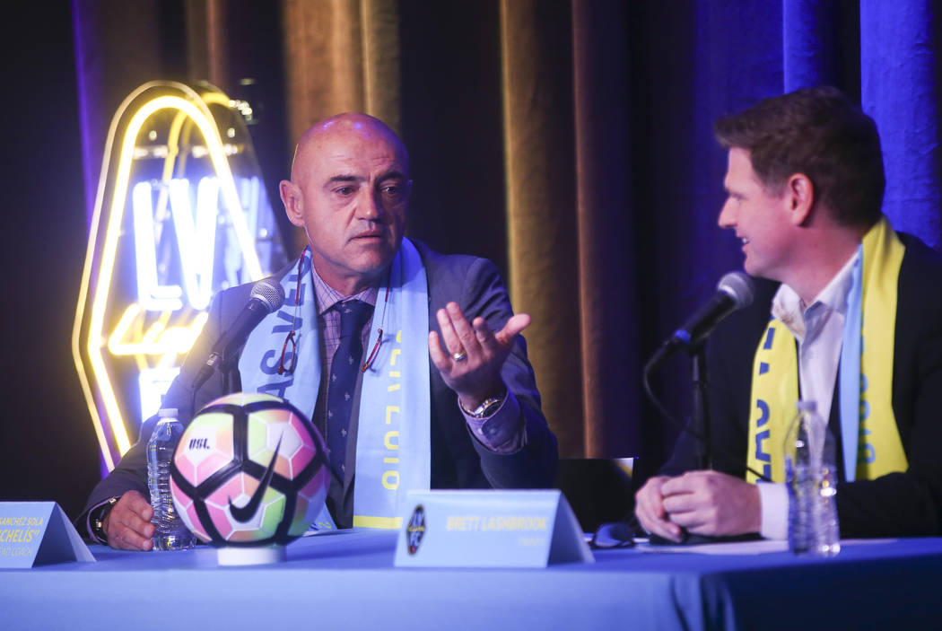 Jose Luis Sanchez Sola, also known as as Chelis, speaks alongside team owner Brett Lashbrook during Sola's first press conference as coach of the Las Vegas Lights FC at Inspire Theater in downtown ...
