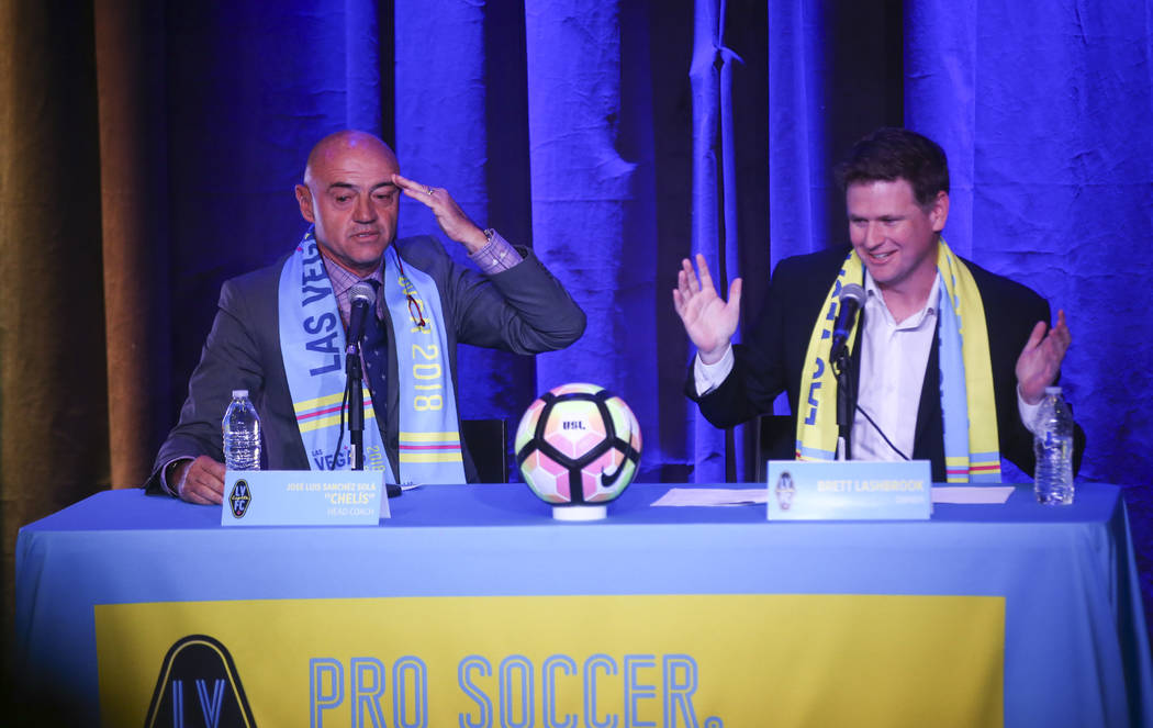 Jose Luis Sanchez Sola, also known as as Chelis, speaks alongside team owner Brett Lashbrook during Sola's first press conference as coach of the Las Vegas Lights FC at Inspire Theater in downtown ...