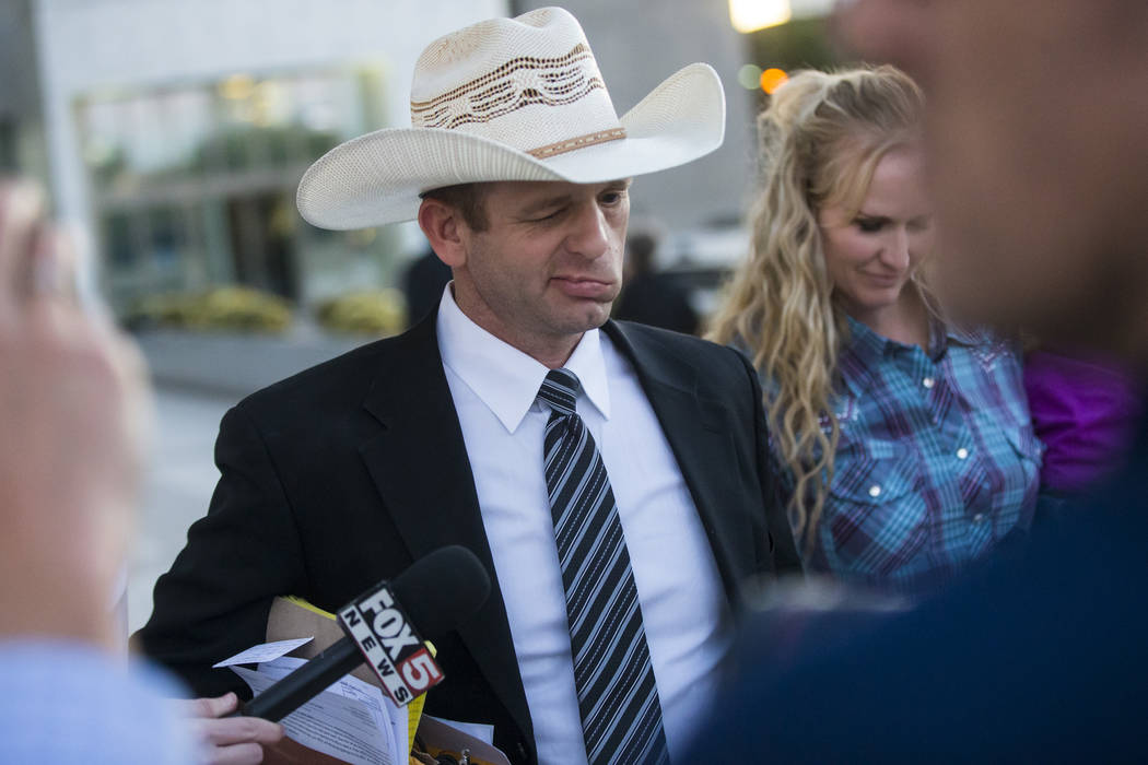 Ryan Bundy, son of Nevada rancher Cliven Bundy, leaves the Lloyd George U.S. Courthouse with his wife, Angela, in downtown Las Vegas on Tuesday, Nov. 14, 2017. Opening statements were delivered in ...
