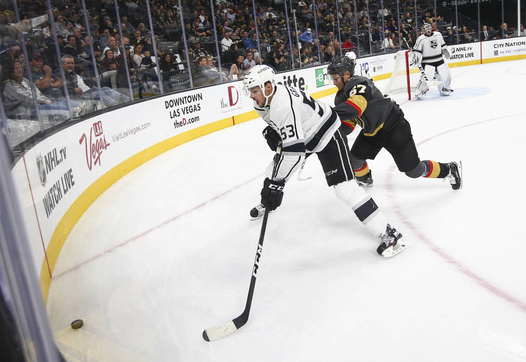 Los Angeles Kings' Kevin Gravel (53) and Golden Knights' Teemu Pulkkinen (67) go after the puck during an NHL preseason hockey game at T-Mobile Arena in Las Vegas on Tuesday, Sept. 26, 2017. The K ...