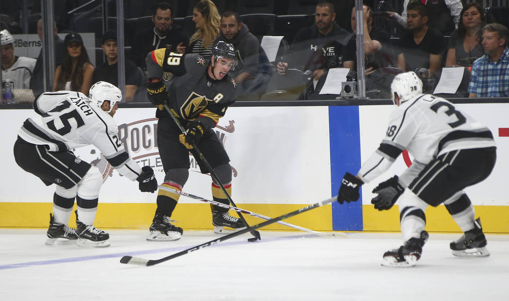 Golden Knights' Reilly Smith (19) tries to get past Los Angeles Kings Brooks Laich and Paul LaDue (38) during an NHL preseason hockey game at T-Mobile Arena in Las Vegas on Tuesday, Sept. 26, 2017 ...