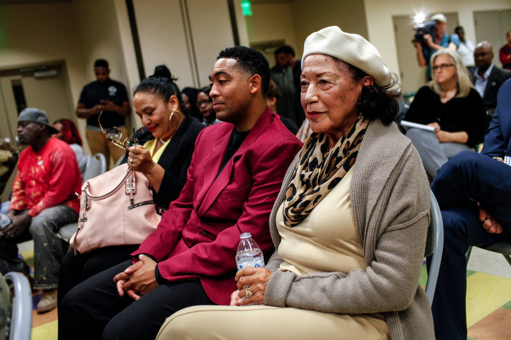 Anna Bailey, 90, right, a former dancer at the Moulin Rouge, sits with her daughter Kimberly Tureaud, 55, left, and grandson Jonathan Backers, 27, center, listen during a town hall meeting at the  ...