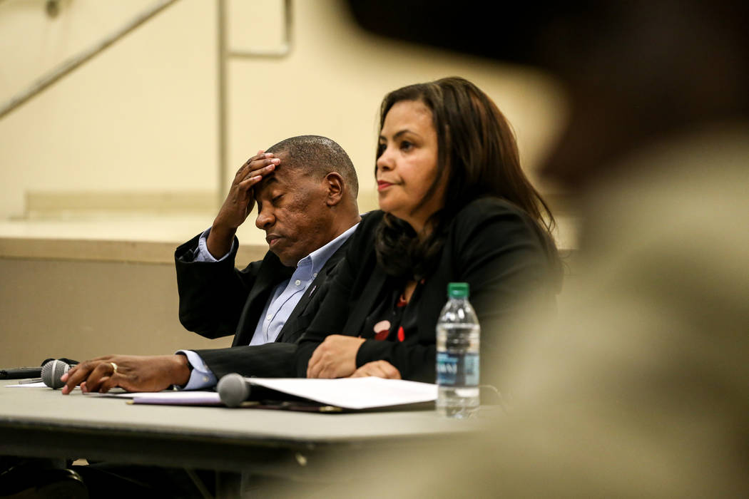 Clark County Commissioner Lawrence Weekly rubs his head as he listens to community members speak during a town hall meeting at the Pearson Community Center discussing the future of the Moulin Roug ...