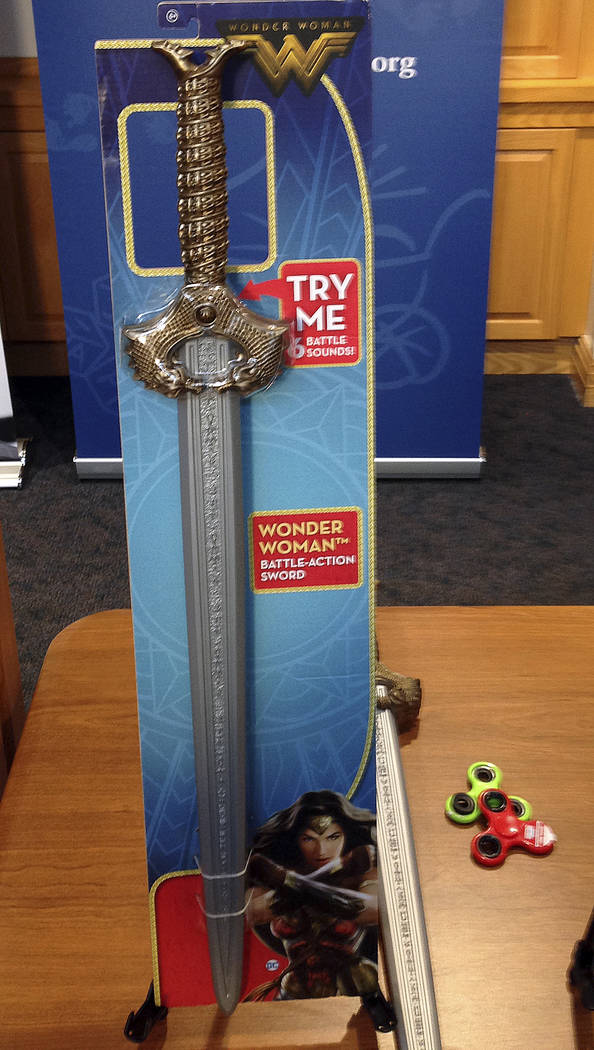 A Wonder Woman &quot;battle sword&quot; is displayed during a news conference Tuesday, Nov. 14, 2017, in Boston, where the child safety group World Against Toys Causing Harm, or W.A.T.C.H. ...