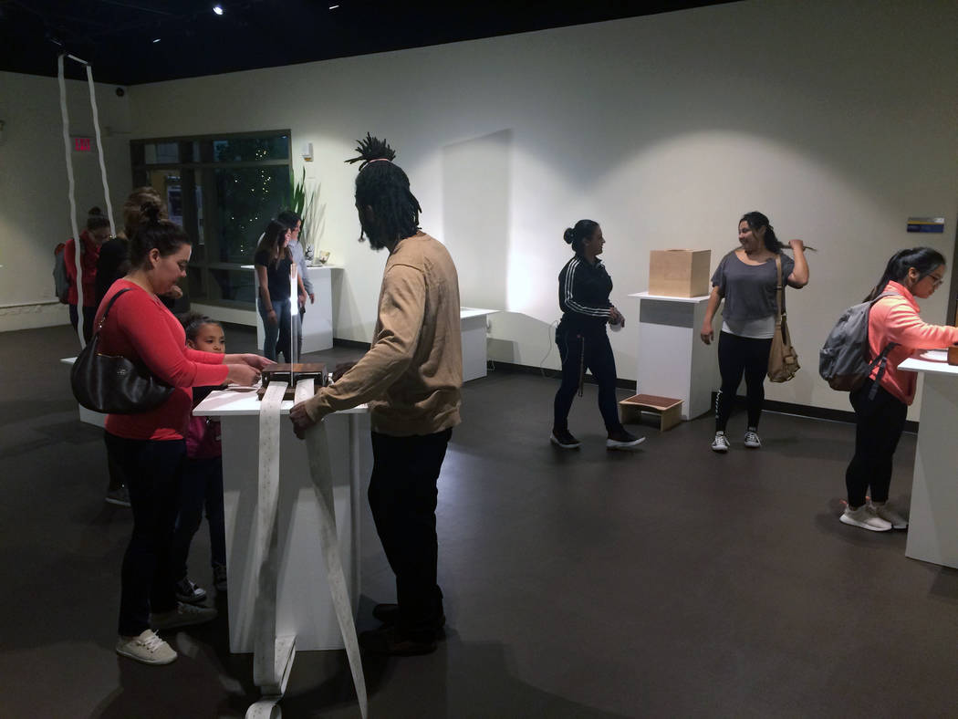 Visitors attend San Diego artist Margaret Noble's exhibition "Resonating Sounds" artist talk and reception event in the fine arts gallery on Nov. 9, 2017 at CSN's North Las Vegas campus, 3200 E. C ...