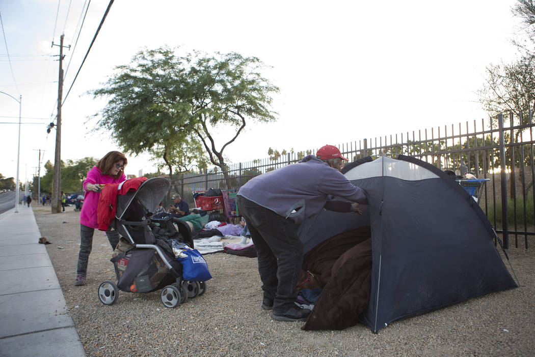 Jody Mathews, left, and Mark Delmage, who are homeless, prepare their tent along Las Vegas Boulevard near Foremaster Lane in Las Vegas, Friday, Nov. 17, 2017. Bridget Bennett Las Vegas Review-Jour ...