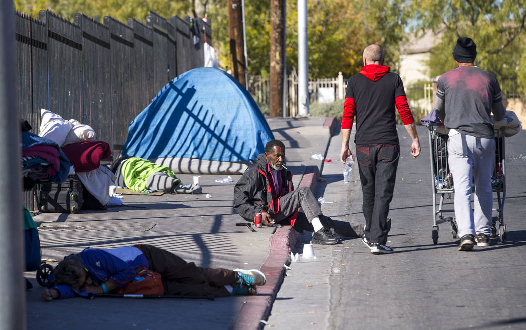 Homeless people gather on Foremaster Lane between Las Vegas Boulevard and Main Street in Las Vegas, Wednesday, Nov. 22, 2017. Richard Brian Las Vegas Review-Journal @vegasphotograph