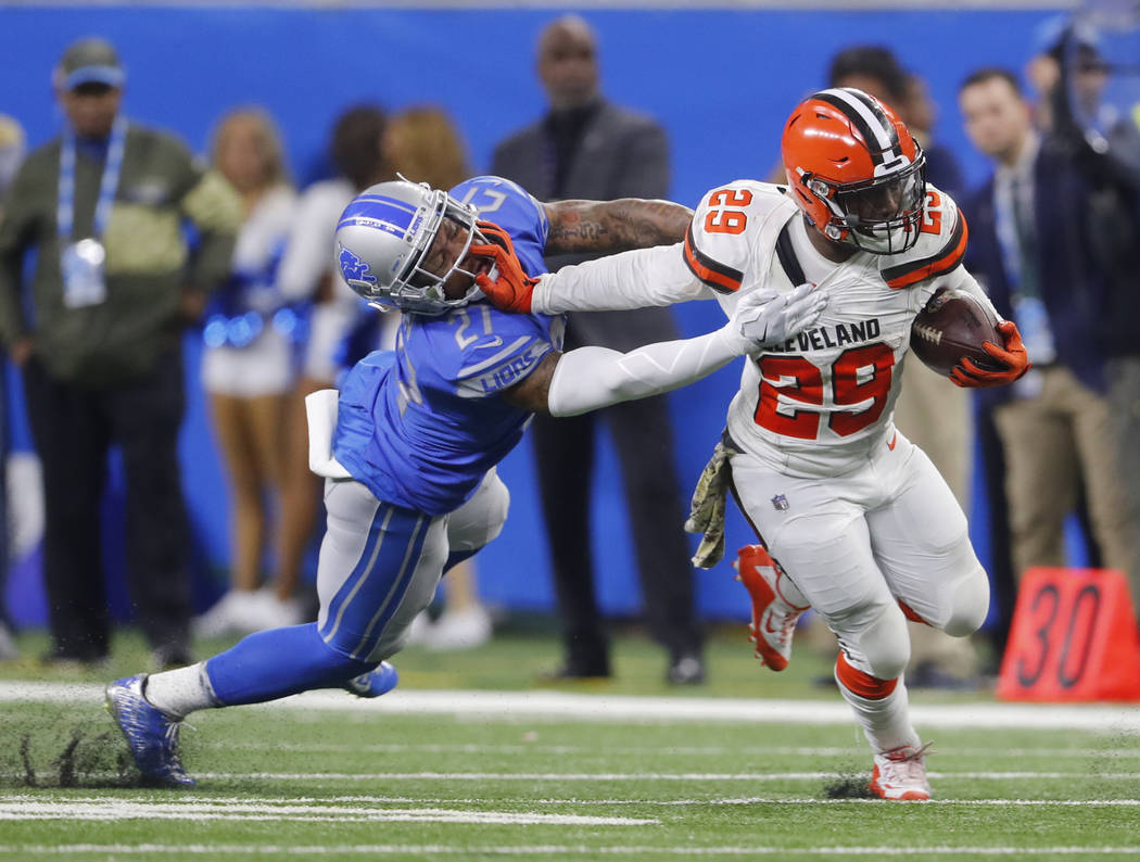 Cleveland Browns running back Duke Johnson (29) stiff arms Detroit Lions free safety Glover Quin (27) during an NFL football game in Detroit, Sunday, Nov. 12, 2017. (AP Photo/Paul Sancya)