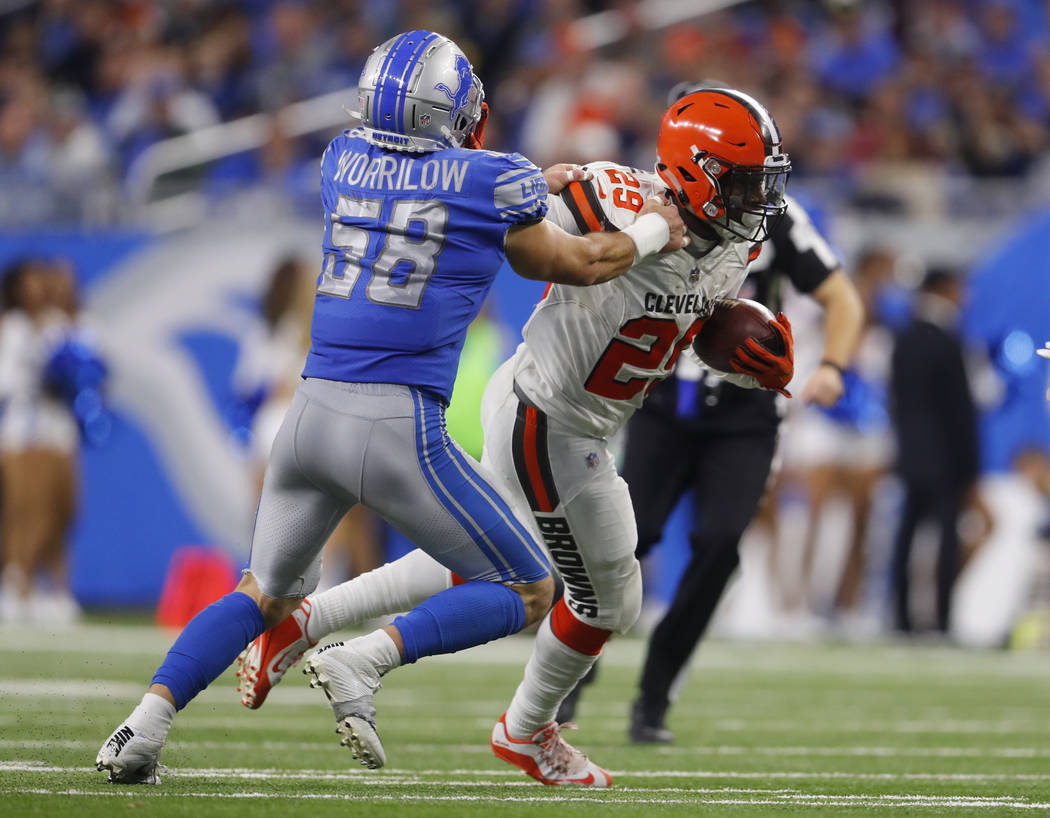 Detroit Lions outside linebacker Paul Worrilow (58) tries to tackle Cleveland Browns running back Duke Johnson (29) during an NFL football game in Detroit, Sunday, Nov. 12, 2017. (AP Photo/Paul Sa ...