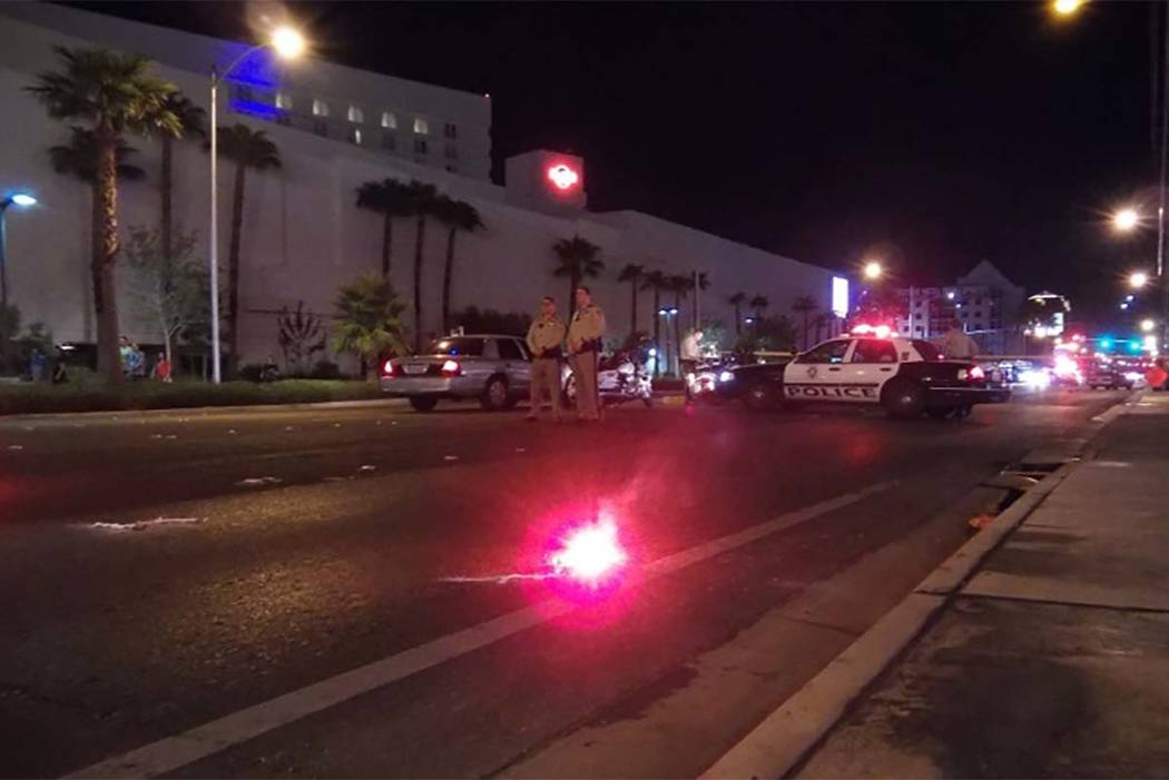 Las Vegas police investigate an accident involving a vehicle and a pedestrian at Paradise Road and East Harmon Avenue. (Max MIchor/Las Vegas Review-Journal)