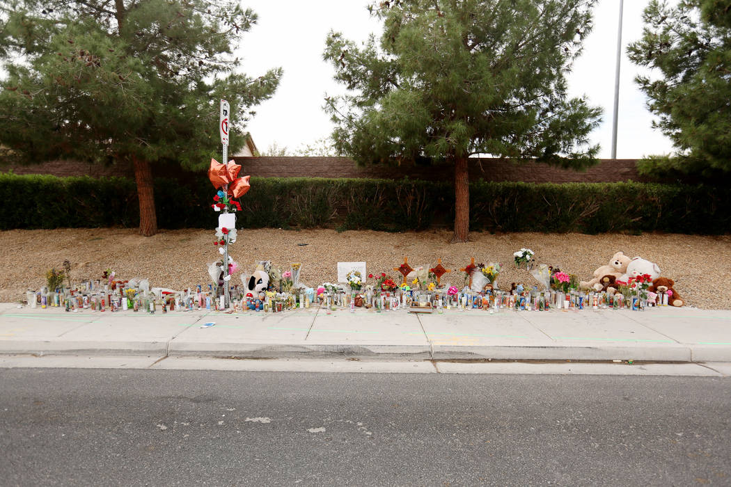 A memorial site on Wednesday, Oct. 18, 2017 where three juveniles between the ages of 12 and 15 were hit by a car on Desert Inn Road and east of Nellis Boulevard in Las Vegas. Elizabeth Brumley La ...